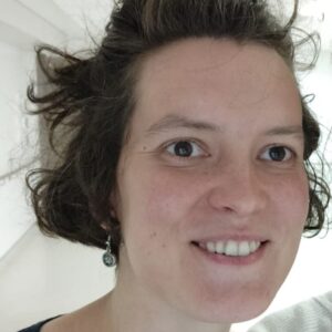 A smiling woman with brown hair